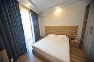 Postel nebo postele na pokoji v ubytování Hotel Elesio