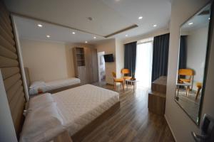 Postel nebo postele na pokoji v ubytování Hotel Elesio