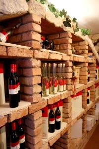 a display of wine bottles in a brick wall at Gästehaus Friedrich in Klöch