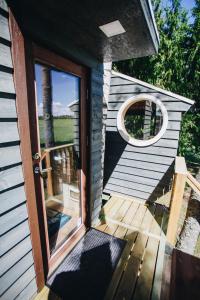 an open door of a house with a porch at Spa Glamping in Kirikumõisa
