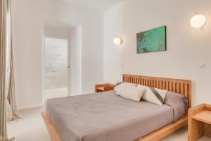 Un pat sau paturi într-o cameră la Les Appartements du Port
