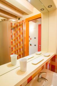 a bathroom with a sink and a mirror at Casa Nova in Burano