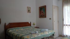 Postel nebo postele na pokoji v ubytování Hotel Taormina