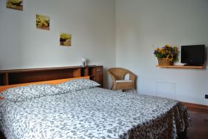 Postel nebo postele na pokoji v ubytování B&B SARI