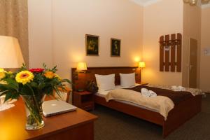 
Ein Bett oder Betten in einem Zimmer der Unterkunft Hotel Arche
