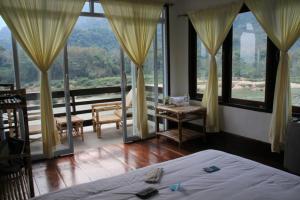 Ning Ning Guesthouse tesisinde bir odada yatak veya yataklar