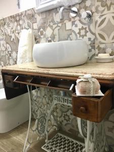 a bathroom with a sink on a counter at The blue house in Marsala