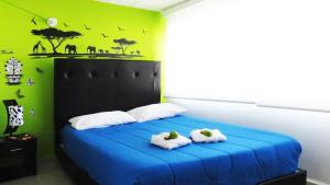 Postel nebo postele na pokoji v ubytování Hotel Bogota House