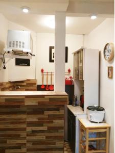 a kitchen with wooden floors and a counter top at White Hope Apartment in Lima
