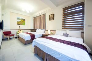 Postel nebo postele na pokoji v ubytování Guitar Charm B&B