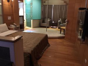 Postel nebo postele na pokoji v ubytování ChangSing Business Motel