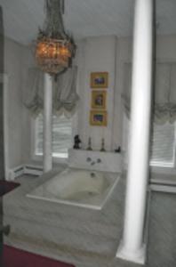 a bathroom with a large tub in a room at Jasones B&B and Restaurant in Marion