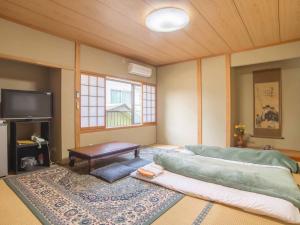 Llit o llits en una habitació de Kenrokuen