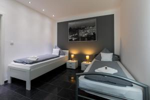En eller flere senge i et værelse på Hotel am Rosenplatz,24 Stunden Check in, kostenfreie Parkplätze
