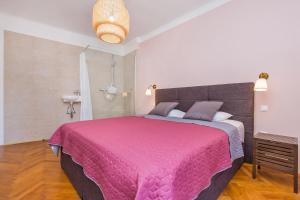 Posteľ alebo postele v izbe v ubytovaní Apartment Dox