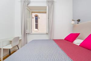 Posteľ alebo postele v izbe v ubytovaní Apartment Dox