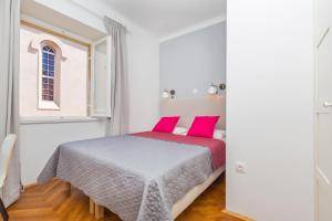 Posteľ alebo postele v izbe v ubytovaní Apartment Dox