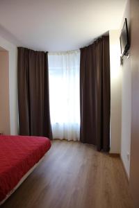 A bed or beds in a room at Hostal Santel San Marcos
