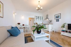 a living room with a couch and a table at Villa Belsito in Lovran