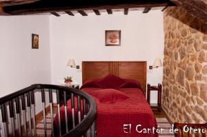 A bed or beds in a room at Estudios El Canton de Otero