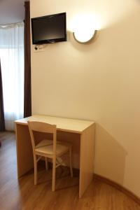 Televízia a/alebo spoločenská miestnosť v ubytovaní Hostal Santel San Marcos