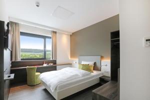 Postel nebo postele na pokoji v ubytování 3G Hotel + 17 fotografií