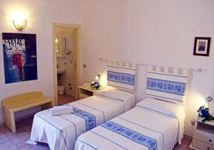 Postel nebo postele na pokoji v ubytování Hotel Montiruju