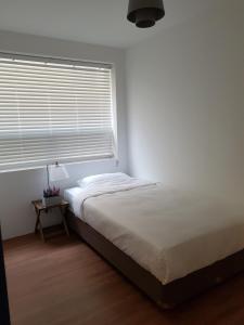 Un pat sau paturi într-o cameră la Hostel Single Single