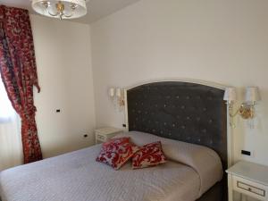 Postel nebo postele na pokoji v ubytování Agriturismo De Luca