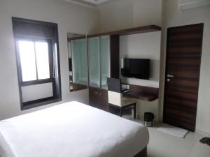 Cama ou camas em um quarto em Hotel Raj Palace
