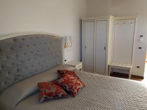 Postel nebo postele na pokoji v ubytování Agriturismo De Luca