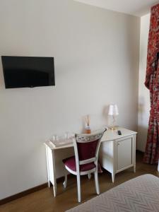 TV a/nebo společenská místnost v ubytování Agriturismo De Luca
