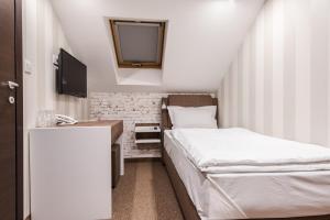 Letto o letti in una camera di Centrum Sobe Rooms Čačak