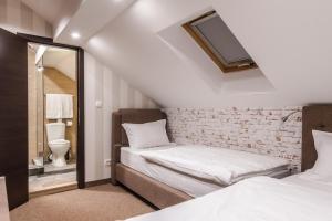 Letto o letti in una camera di Centrum Sobe Rooms Čačak