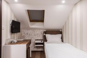 Letto o letti in una camera di Centrum Sobe Rooms Čačak