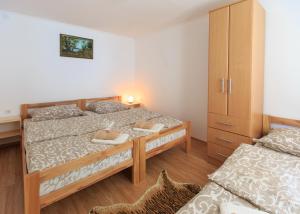 Postel nebo postele na pokoji v ubytování Fortuna Apartments