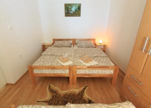 Postel nebo postele na pokoji v ubytování Fortuna Apartments