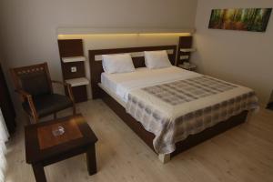 Postel nebo postele na pokoji v ubytování Royal Bilgic Hotel