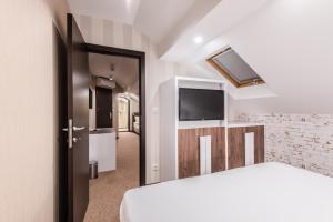 Letto o letti in una camera di Centrum Sobe Rooms Čačak
