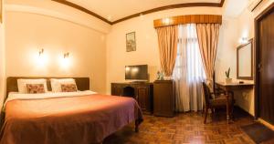 Cama ou camas em um quarto em Hotel Excelsior