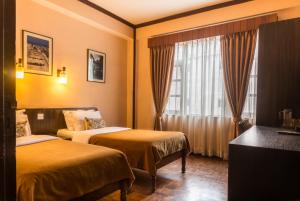 Cama ou camas em um quarto em Hotel Excelsior