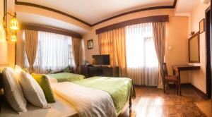 Cama ou camas em um quarto em Hotel Excelsior
