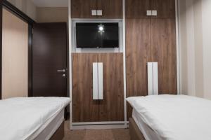 Letto o letti in una camera di Centrum Sobe Rooms Čačak