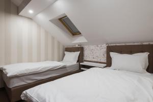 Letto o letti in una camera di Centrum Sobe Rooms Čačak