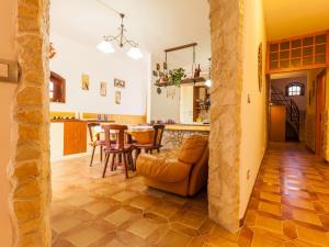 a kitchen and living room with a table and chairs at Villa Giovanna in Arenella +72 photos