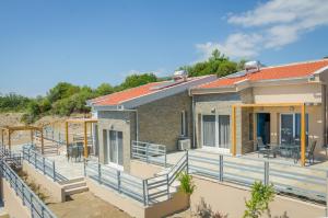 a home under construction with a large deck at Arina Villa in Skala Marion