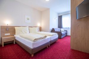 Posteľ alebo postele v izbe v ubytovaní Aparthotel Pichler