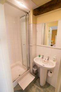 a bathroom with a sink and a shower at The Talbot Inn in Cirencester