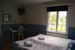 Postel nebo postele na pokoji v ubytování Lugnet Malung Hotell