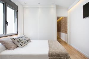 En eller flere senge i et værelse på Sweet Home Sitges BY BLAUSITGES